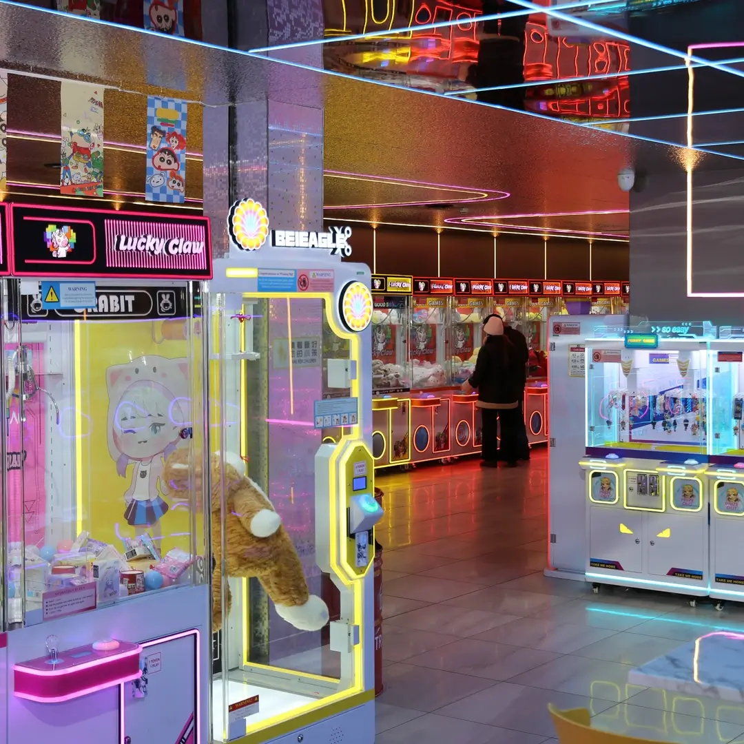 Rows of claw machines on the Lucky Claw arcade floor in Birmingham