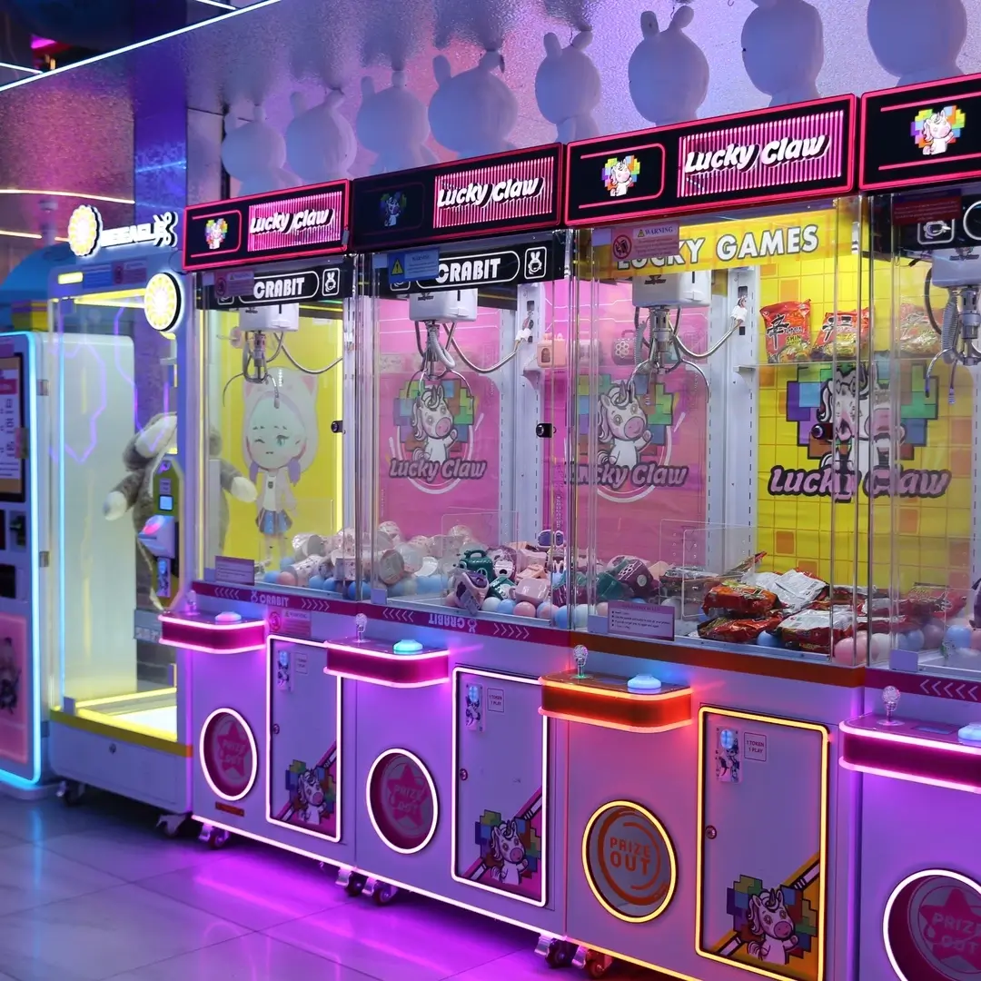 A row of pink Lucky Claw claw machines
